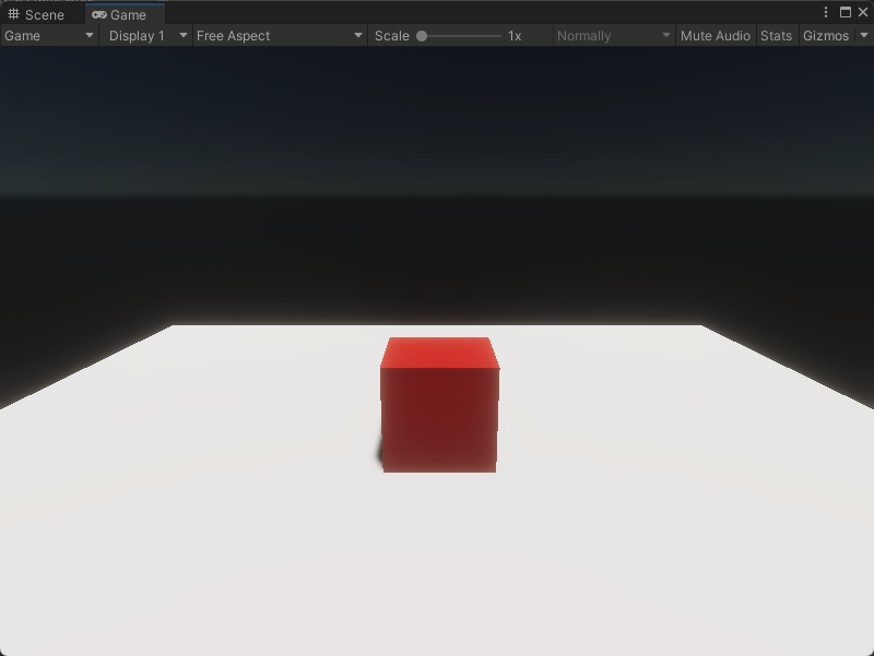 An image of the Game view, that displays a simple plane with a single red cube.